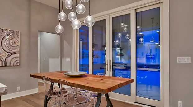 Dining area with pendant lighting and glass doors