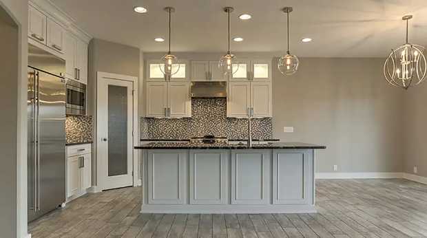 Villa kitchen with island seating and pendant lighting